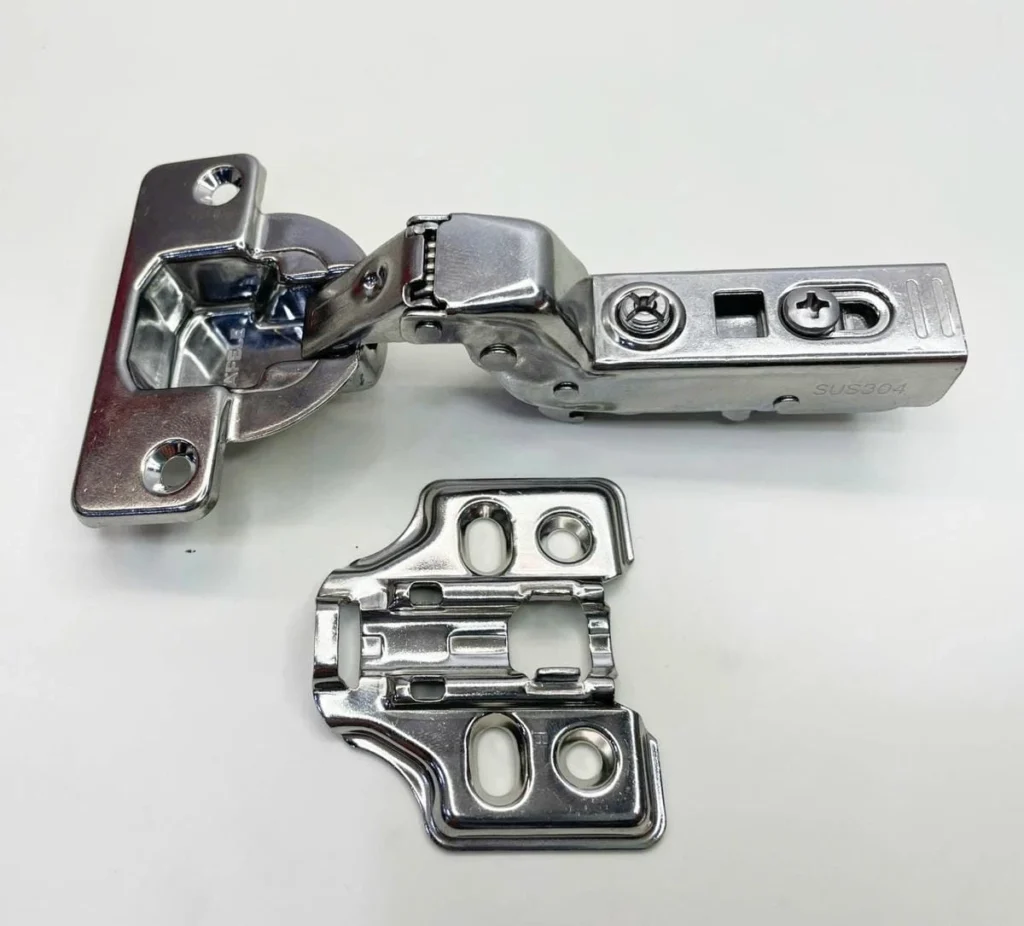 (SM,98º,GC,inox ) Bản lề tủ HAFELE 334.25.000 (Lọt lòng,gỗ dày, inox304)